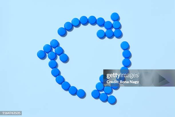 recycling symbol made of plastic bottle caps - bottle cap stock pictures, royalty-free photos & images