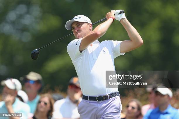 Justin Thomas watches his tee shot on the second hole during the final round of the World Golf Championship-FedEx St Jude Invitational at TPC...