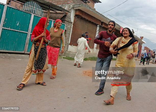 Kashmiri woman weeps after her relative was injured during clashes against India's revoking of Article 370 of its constitution in Srinagar,Kashmir on...