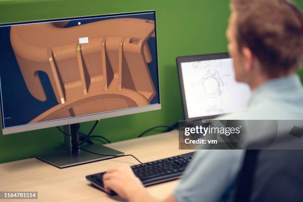 engineer using a computer to make a 3d model of a machine part - cad drawing stock pictures, royalty-free photos & images