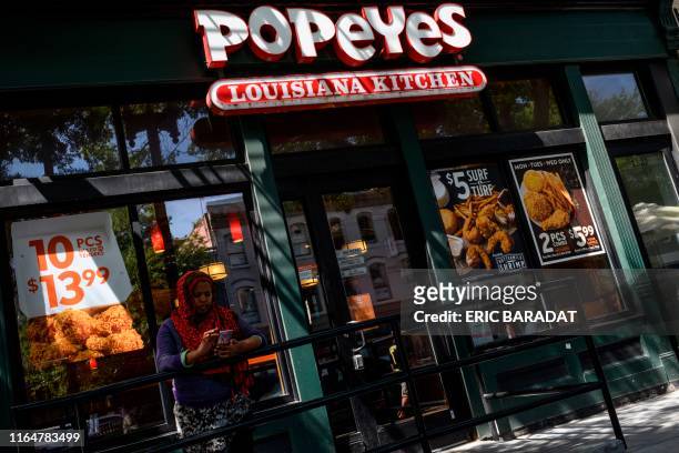 Popeyes fast food chain restaurant is seen on August 30, 2019 on a street of Washington D.C. - Chick it out! US restaurant chain Popeyes launched a...