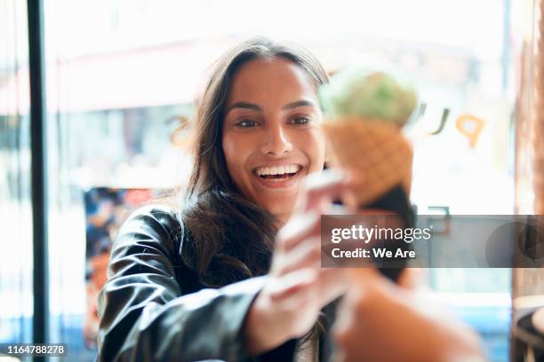 woman buying an ice cream at cafe - ice cream parlour stock pictures, royalty-free photos & images