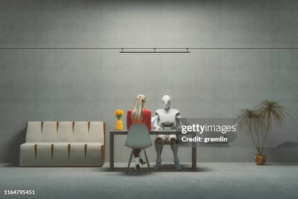 entrevista de trabajo con cyborg futurista - humano-robot fotografías e imágenes de stock