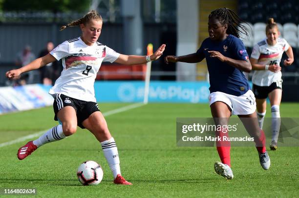 Leonie Koster of Germany takes on Sandy Baltimore of France during the UEFA Women's Under19 European Championship Final between France Women's U19...