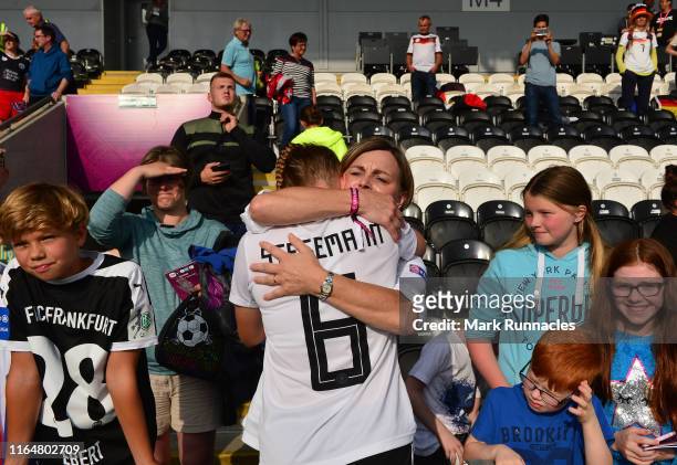 Greta Stegemann of Germany embraces some in the crowd at the final whistle during the UEFA Women's Under19 European Championship Final between France...