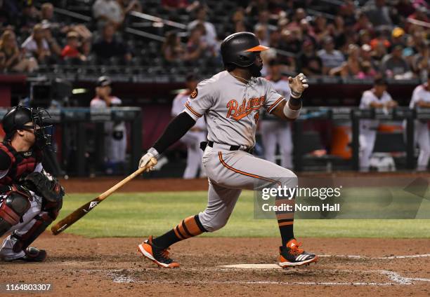 Dwight Smith Jr of the Baltimore Orioles follows through on a swing against the Arizona Diamondbacks at Chase Field on July 23, 2019 in Phoenix,...
