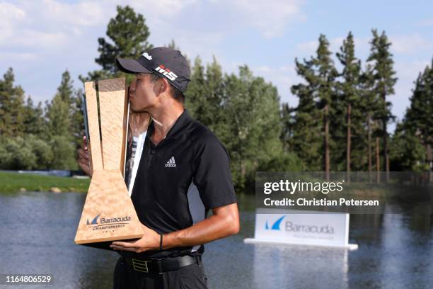 Collin Morikawa of the United States poses with the trophy after winning during the final round of the Barracuda Championship at Montreux Country...