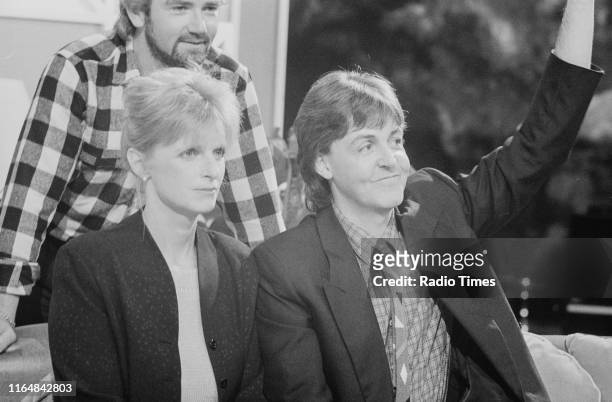 Presenter Noel Edmonds interviewing musicians Linda McCartney and Paul McCartney for the BBC television series 'The Late, Late Breakfast Show',...