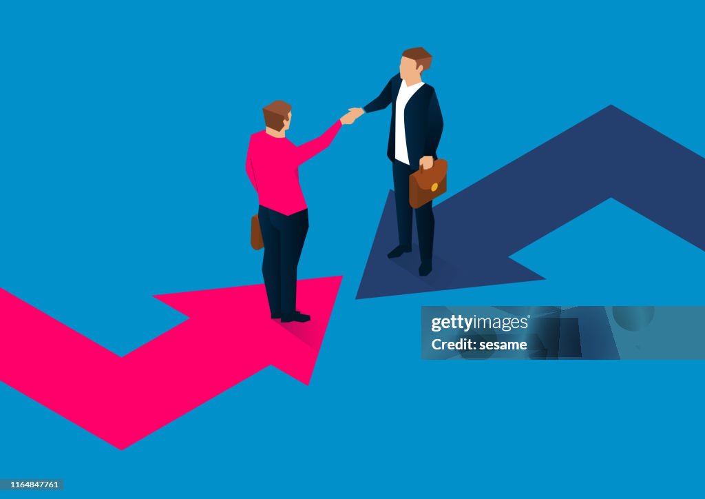 Two businessmen shaking hands on a turning arrow