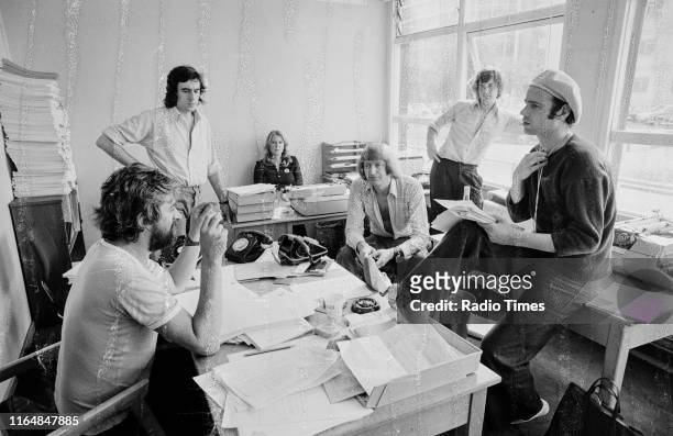 Writers Ian MacNaughton, Terry Jones, unknown, Graham Chapman, Michael Palin and Neil Innes in a script conference for BBC television show 'Monty...