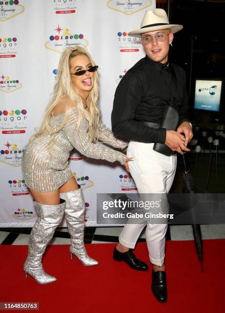 Tana Mongeau and Jake Paul joke around during their wedding reception at the Sugar Factory American Brasserie at the Fashion Show mall on July 28,...