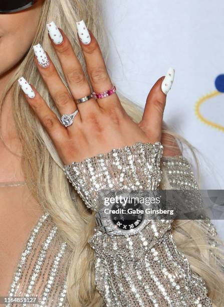 Tana Mongeau, rings and watch detail, shows off her wedding ring during her wedding reception at the Sugar Factory American Brasserie at the Fashion...