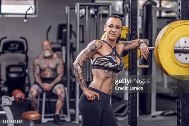 tattooed senior couple during gym workout - old woman tattoos stock pictures, royalty-free photos & images