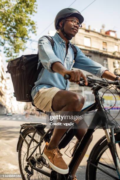 African Delivery Rider African Delivery Rider Photos and Premium High Res Pictures - Getty Images