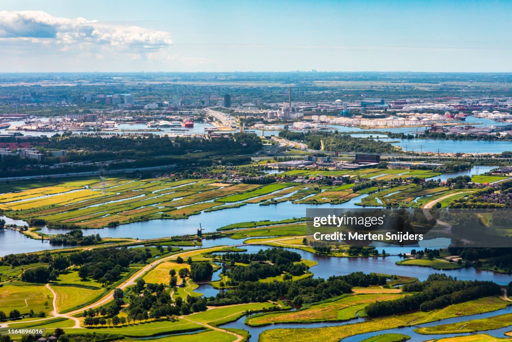 Aerial of Coentunnel, Amsterdam Sloterdijk, Noord and Houthavens behind Twiske Recreational Park