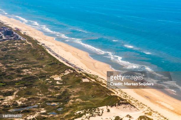 aerial of dunes and beach at egmond aan zee - empty beach stock pictures, royalty-free photos & images