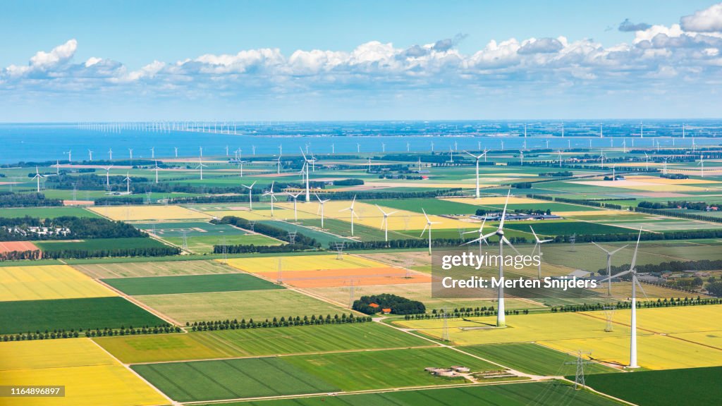 Wind turbine installations at Flevoland farm fields