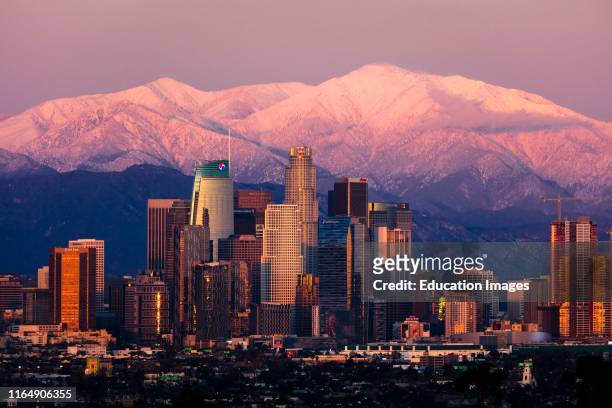 Los Angeles Skyline framed by San Bernadino Mountains and Mount Baldy with fresh snow from Kenneth Hahn State Park.