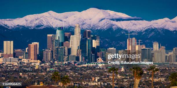 City of Angeles, Los Angeles Skyline framed by San Bernadino Mountains and Mount Baldy with fresh snow from Kenneth Hahn State Park.