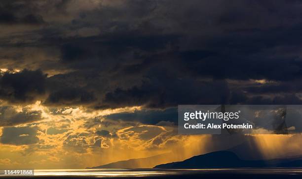 stormy sunset over sea - horisont stock pictures, royalty-free photos & images