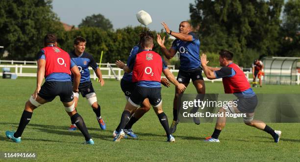 Jonathan Joseph passes the ball during the England pre Rugby World Cup training session held on July 29, 2019 in Treviso, Italy.