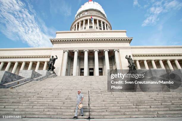 Havana's city historian Eusebio Leal walks down the stairway after delivering a speech in front of El Capitolio, the National Capitol Building, for...