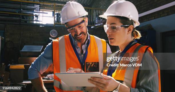 connected to the current happenings in the field of engineering - capacete de trabalho imagens e fotografias de stock