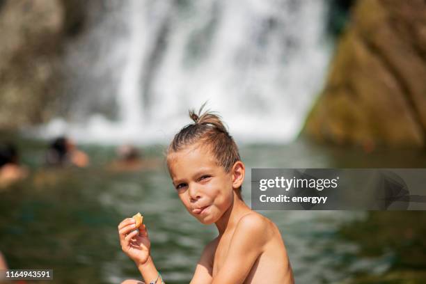 happy little boy - boy river looking at camera stock pictures, royalty-free photos & images