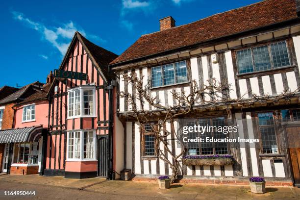 Picturesque local shops on the Market Square Lavenham Suffolk England UK.