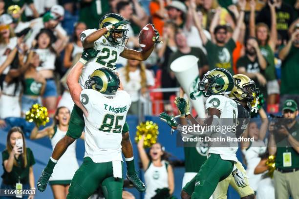 Wide receiver Dante Wright of the Colorado State Rams celebrates with tight end Trey McBride after scoring a first quarter touchdown against the...