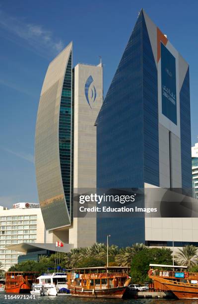 Buildings of the National Bank of Dubai and the Dubai Chamber of Commerce and Industry in the Deira district, Dubai, United Arab Emirates.