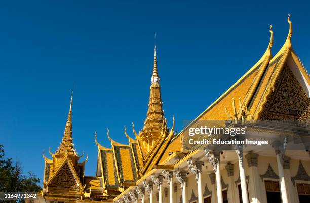 Throne Hall Preah Thineang Dheva Vinnichay with spires and chofahs at the Royal Palace complex, Phnom Penh, Cambodia.