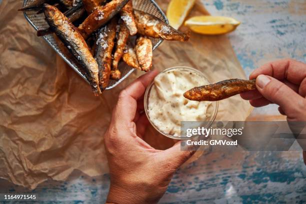 crispy smelt fish with sea salt and fresh lemon - cook battered fish stock pictures, royalty-free photos & images