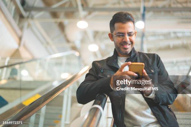 mobile phone online shopping - airport man stock pictures, royalty-free photos & images