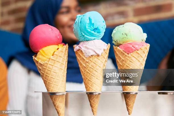 colourful ice creams in cafe - customized stock-fotos und bilder