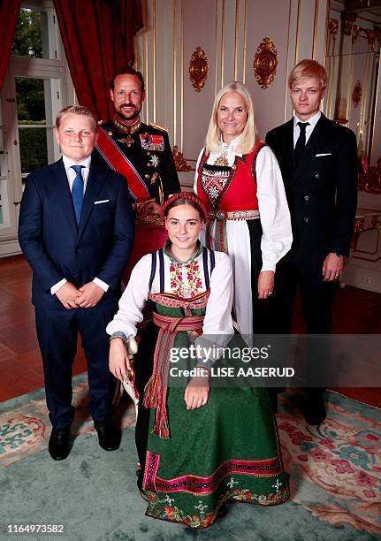 Princess Ingrid Alexandra , wearing a national costume "Raudtroye-bunad", poses with her siblings and parents Prince Sverre Magnus, Crown Prince...
