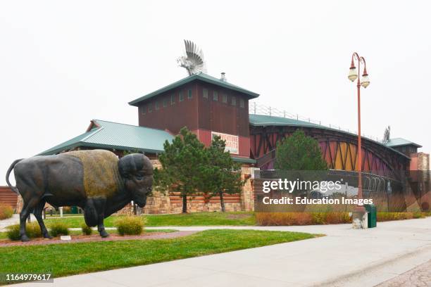 Nebraska, Kearney, Great Platte River Road Archway over Interstate 80, Bison Sculpture in Foreground.