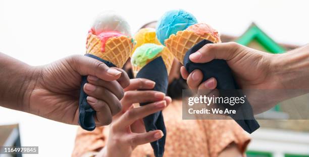 ice cream cone cheers! - cornet stock pictures, royalty-free photos & images