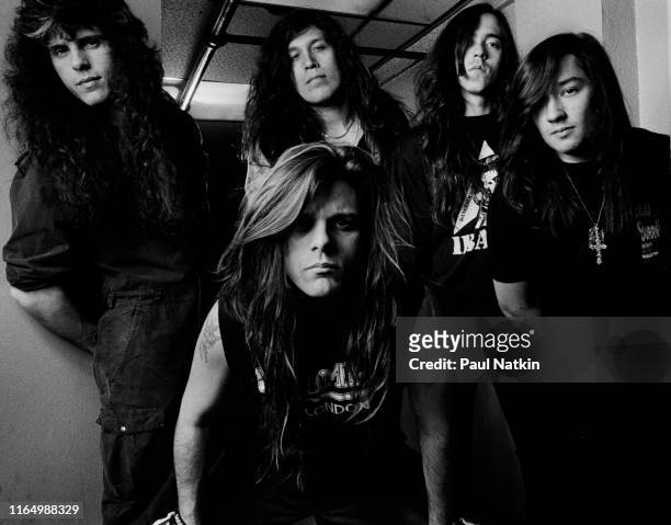 Portrait of the members of American Thrash Metal group Testament pose backstage at the Vic Theater, Chicago, Illinois, March 25, 1990. Pictured are,...