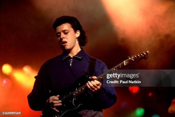 British musician Roland Orzabal, of teh group Tears For Fears, plays guitar as he performs onstage at the Aragon Ballroom, Chicago, Illinois, June...