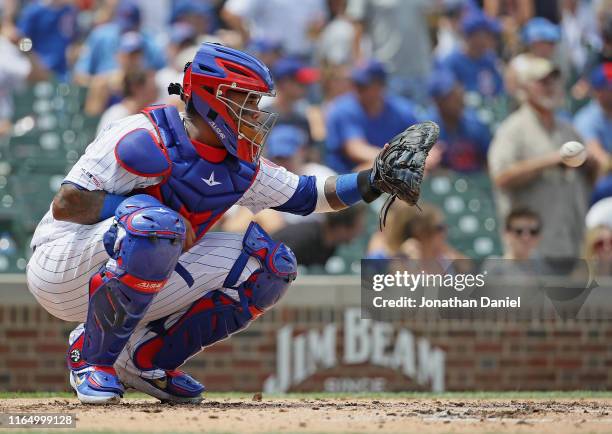 Martin Maldonado of the Chicago Cubs catches a warm-up pitch against the San Diego Padres at Wrigley Field on July 19, 2019 in Chicago, Illinois.