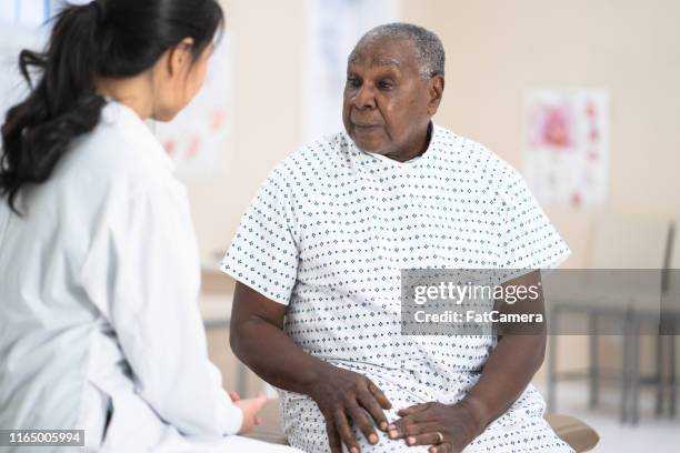 senior man at the doctor - doctor with dementia patient stock pictures, royalty-free photos & images