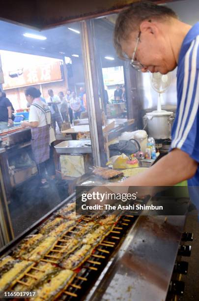 Staff grills eels on July 27, 2019 in Urayasu, Chiba, Japan. It is said that people eat eel on the Doyo-no-Ushi-no-Hi, July 27 this year, day of the...