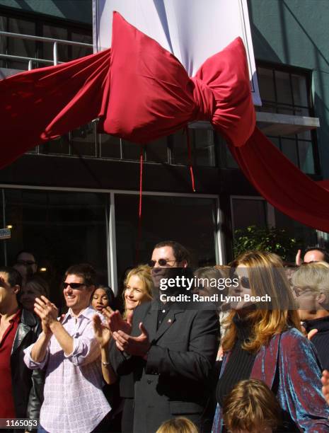 Actors Tom Cruise, Kelly Preston, John Travolta and Kirstie Alley listen to actress Jenna Elfman speak at the opening of the Church of Scientology,...