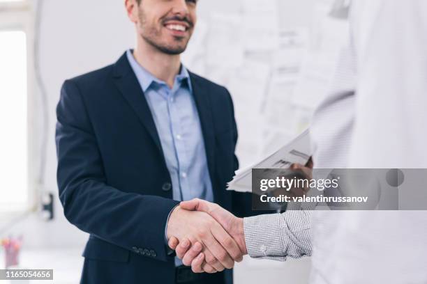 business people shaking hands, finishing up a meeting - bank manager imagens e fotografias de stock