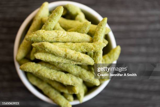 pea crisps - crunchy snacks stock pictures, royalty-free photos & images