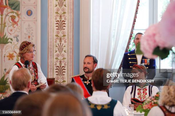 Queen Sonja of speaks to Princess Ingrid Alexandra as Crown Prince Haakon looks on during a lunch at the Royal Castle after her confirmation ceremony...