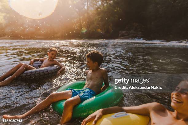 a perfect summer day - floating on water stock pictures, royalty-free photos & images