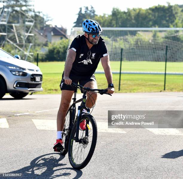 Jurgen Klopp manager of Liverpool arriving to a training session on a bike a training session on July 30, 2019 in Evian-les-Bains, France.