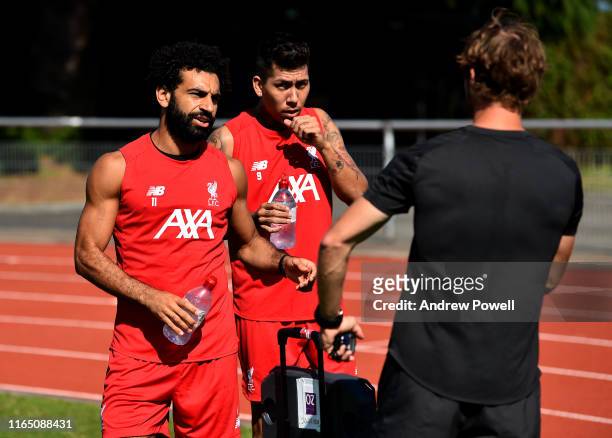 Mohamed Salah and Roberto Firmino of Liverpool during a training session on July 30, 2019 in Evian-les-Bains, France.